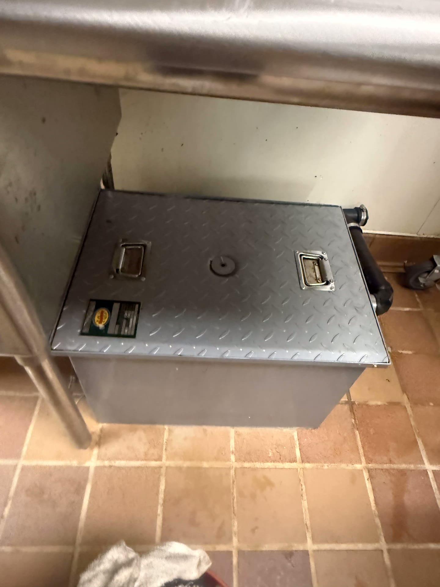 Under-sink commercial grease interceptor in a Riverside kitchen