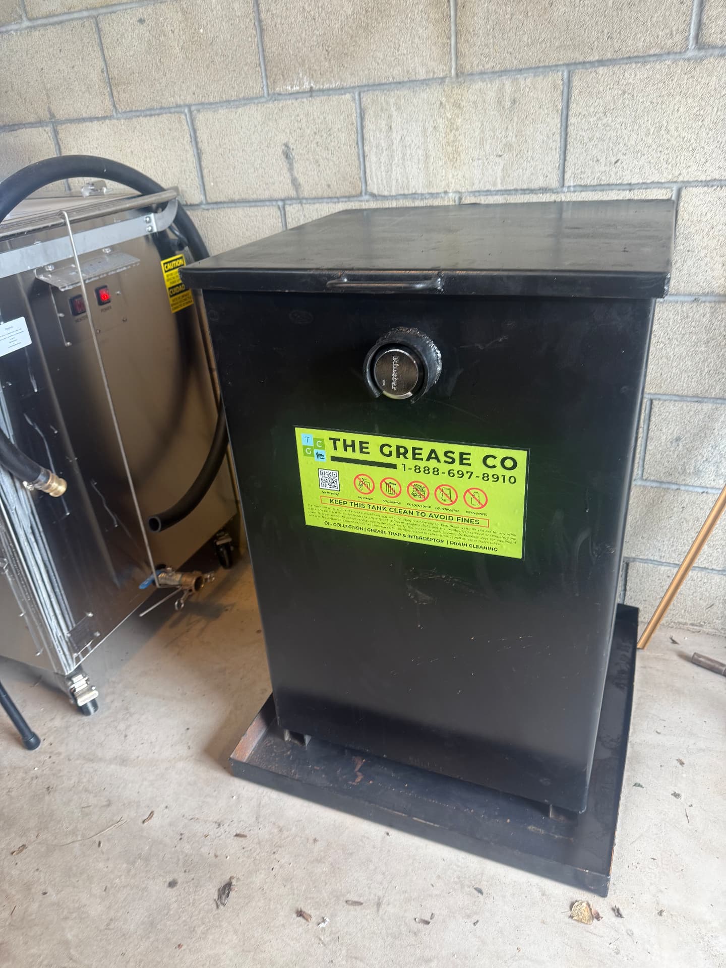 Locked used cooking oil storage tank supplied to a commercial kitchen in Blythe, California