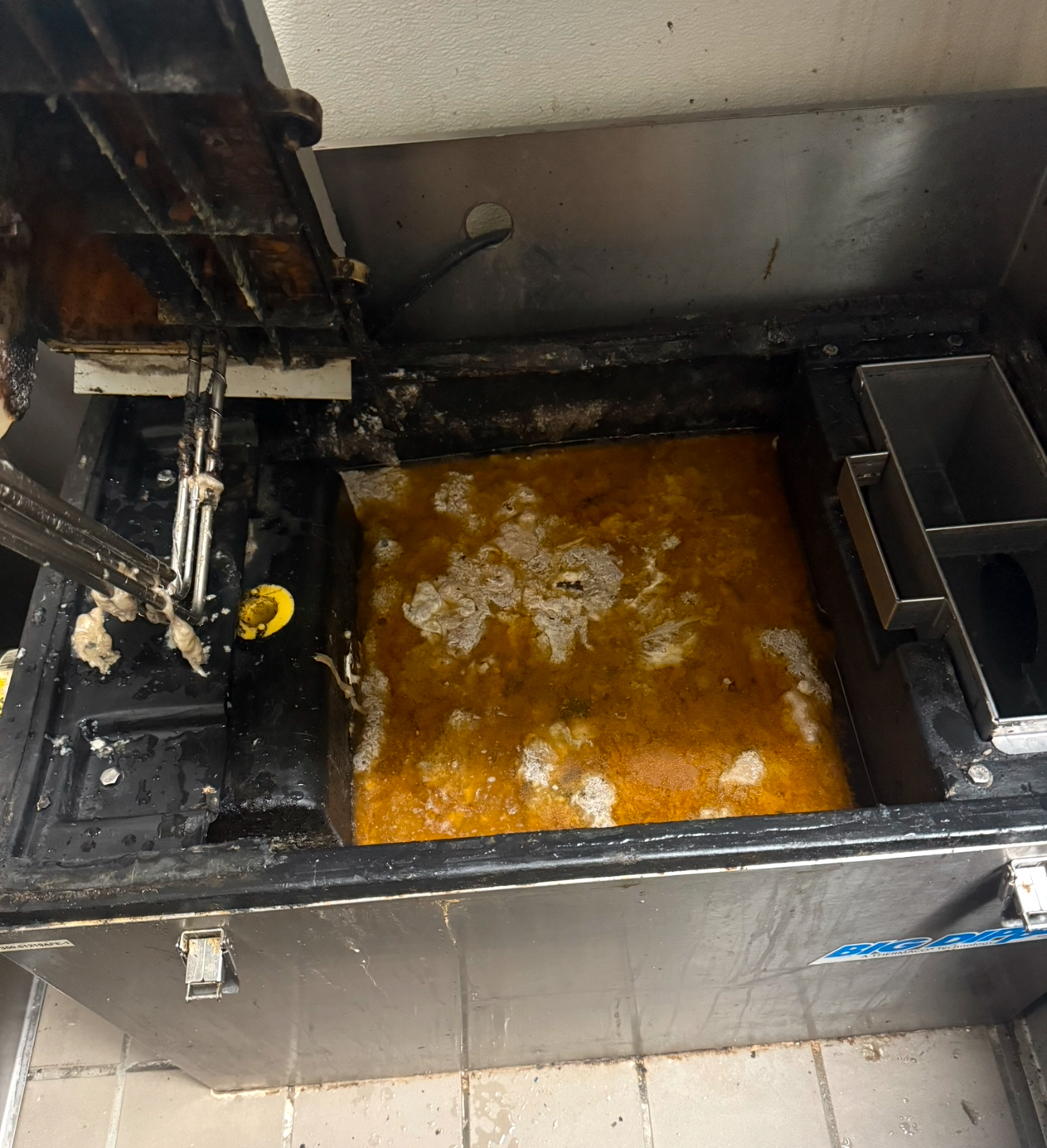Loaded restaurant grease trap before cleaning serving Beaumont, California