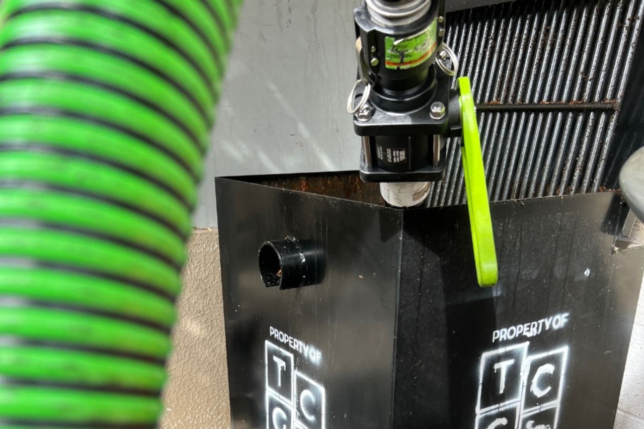 Used cooking oil being pumped from a sealed container in Banning