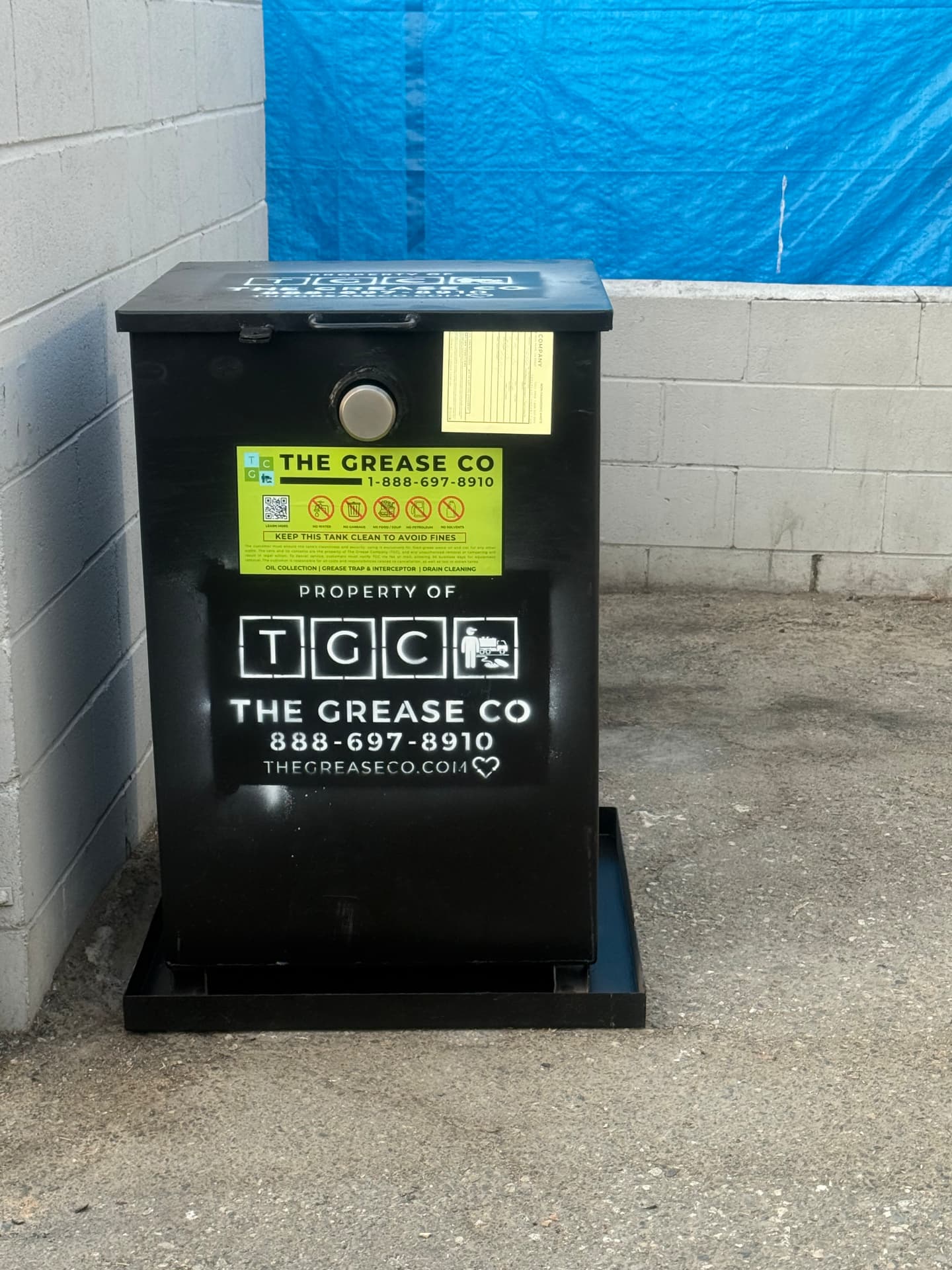 Bulk fryer oil storage totes inside a food facility in Indio, California
