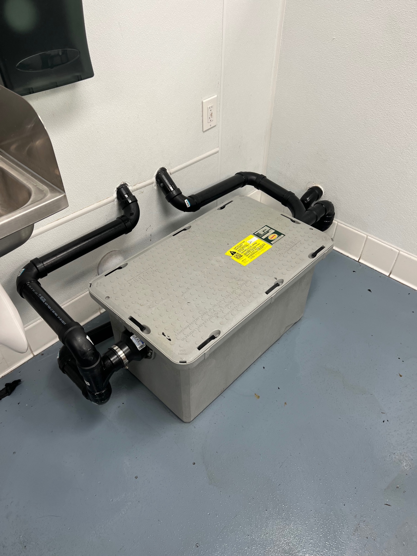 Small indoor grease trap serving a commercial kitchen in Banning, California